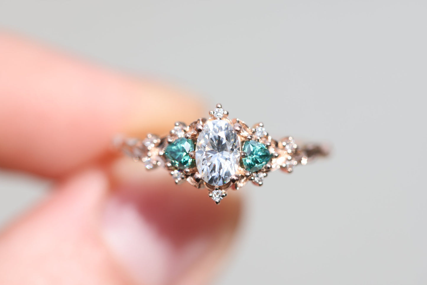 [Oramore Jewelry]Briar rose three stone with oval moissanite and teal moissanite side stones